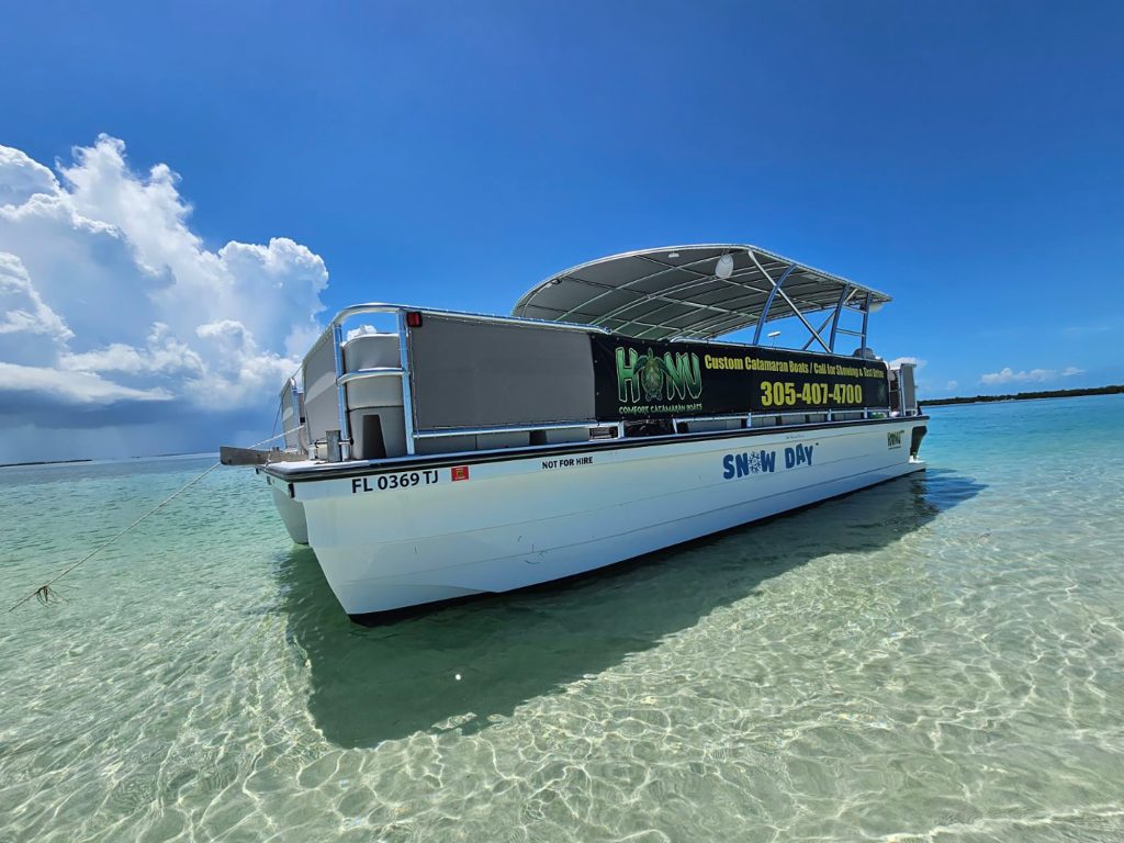 A Custom cat's boat floats in the water