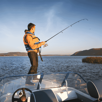 Man fishing from yacht enjoying Custom Cat Charters offshore adventure