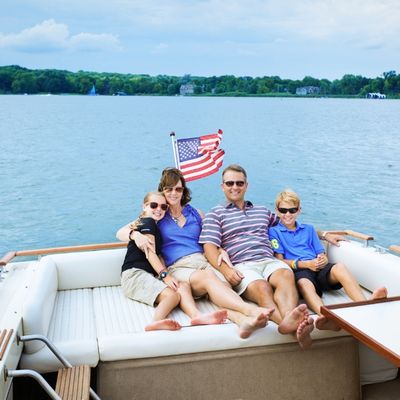 Happy family enjoying luxury yacht ride with Custom Cat Charters in Florida
