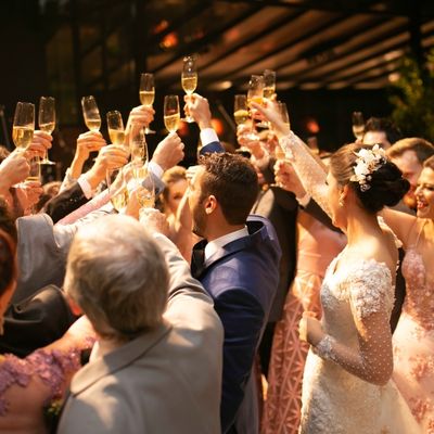 Wedding guests cheering and celebrating love aboard Custom Cat Charters yacht