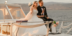 Romantic yacht wedding couple posing on deck with Custom Cat Charters service