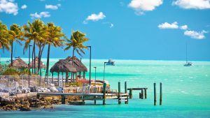 Florida Keys Weather Guide for Wedding Planning with turquoise water, palm trees, and tropical shoreline