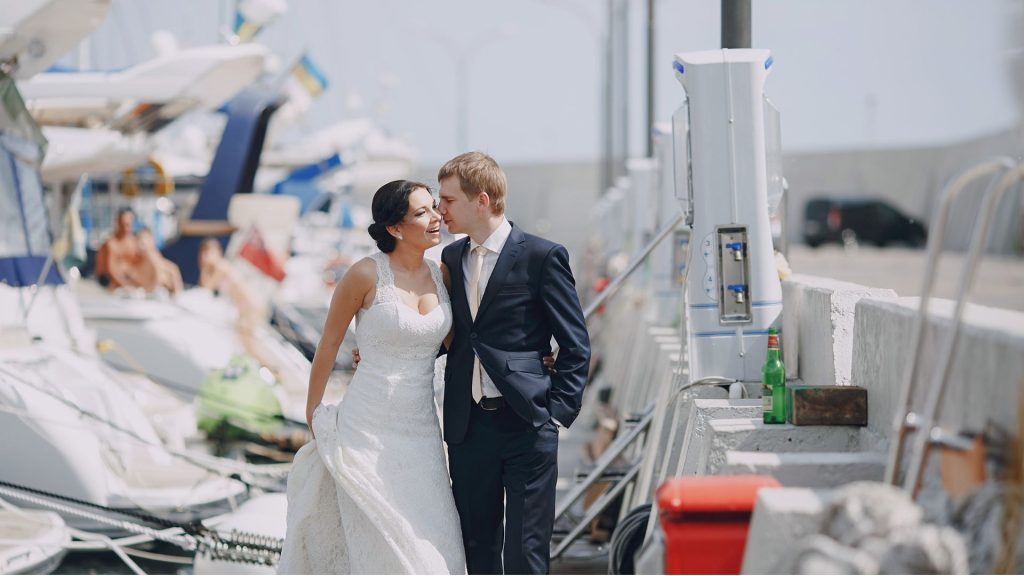 Florida Keys summer wedding couple celebrating on a boat during peak wedding season.