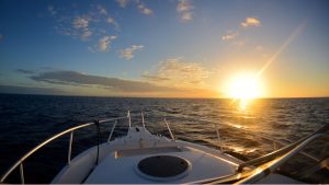 Florida Keys wedding sunset over the ocean during a boat ceremony at golden hour