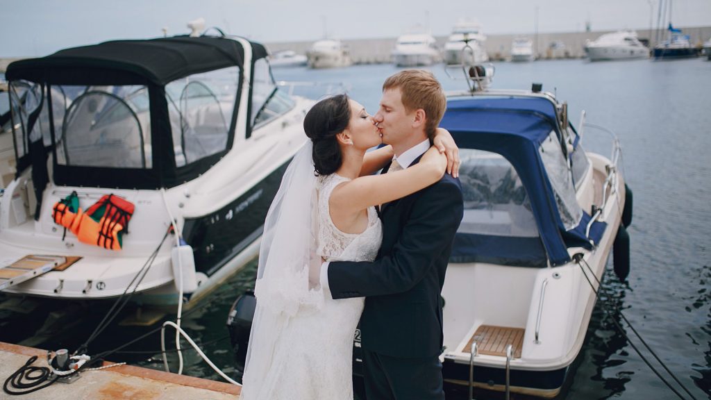 Florida Keys yacht wedding couple celebrating on a luxury boat with ocean sunset views